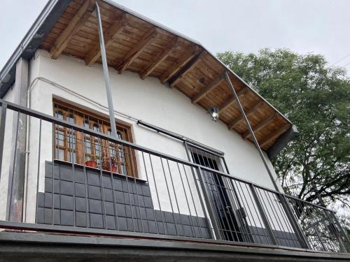 a balcony of a house with a fence at DYCS DEPARTAMENTOS in San Rafael