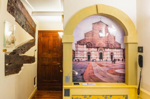 an entrance to a church with a painting on the wall at Art Hotel Commercianti in Bologna