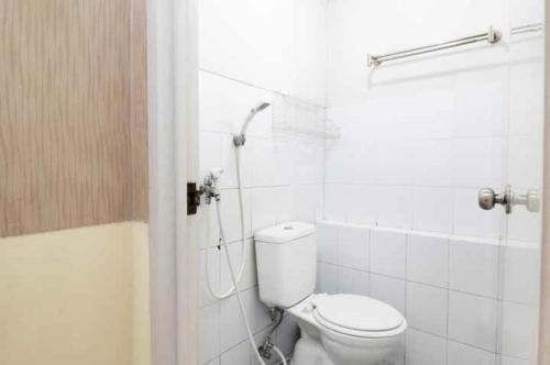 a bathroom with a toilet and a shower at Apartemen kalibata city by Rama Property in Jakarta