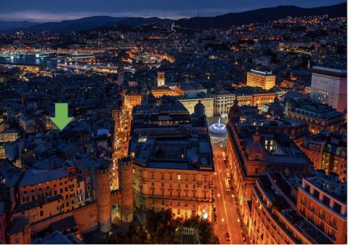 an aerial view of a city at night at Erbe12 loft&park historic apartment centro città in Genova