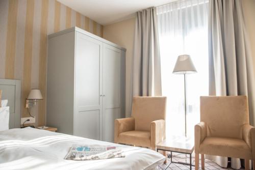 Postel nebo postele na pokoji v ubytování Hotel Ascovilla Charming Hideway