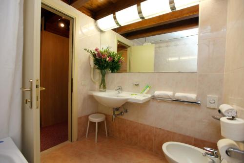 a bathroom with a sink and a mirror at Villa Fiorita in Monastier di Treviso