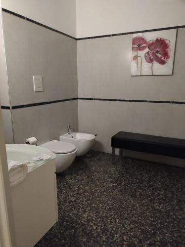 a bathroom with a sink and a toilet and a tub at B&B Mini Hotel Incity-close train station and port- in Salerno