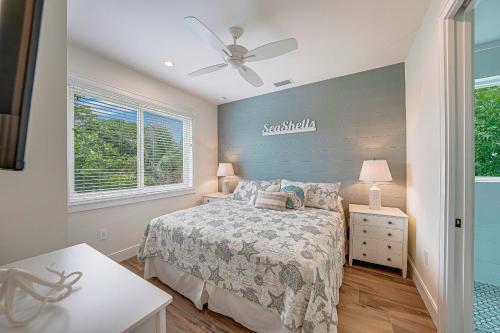 a bedroom with a bed and a ceiling fan at Sea Gal in Bradenton Beach