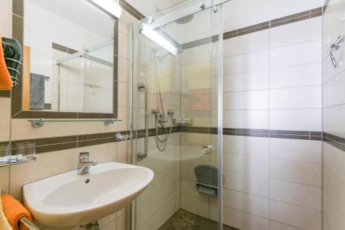 a bathroom with a sink and a shower at Margarete Gwehenberger in Kleinarl
