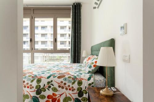 a bedroom with a bed and a window at The Tropical Place in Milan