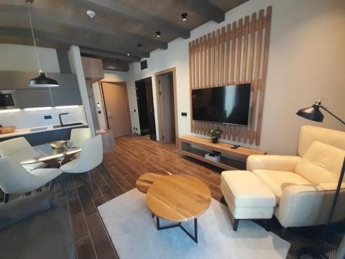 a living room with a couch and a table at Stefany in Kopaonik