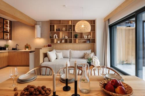 a kitchen and living room with a table with fruit on it at Stylchyn Park - Czorsztyn Exclusive - by Upstairs in Kluszkowce