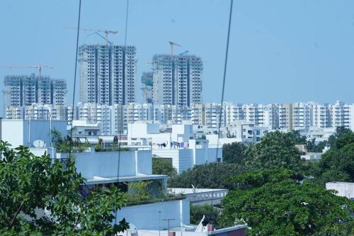 a view of a city with tall buildings at Veetil -3BHK A/C, Kukatpally, Hyderabad in Hyderabad