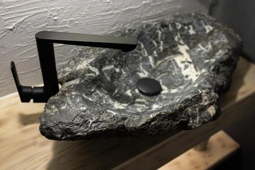 a rock with a computer mouse on top of it at Black & White Villas by Fomich Hotels Group in Bukovel