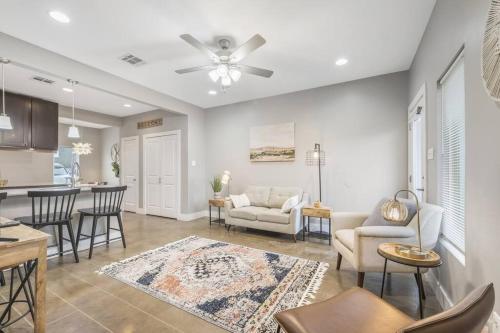 a living room with a couch and a table at Cozy 2 Bed Townhome near the Hospital in Lafayette
