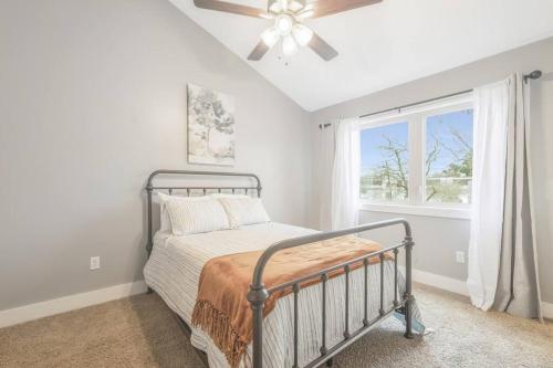 a bedroom with a bed and a window at Cozy 2 Bed Townhome near the Hospital in Lafayette