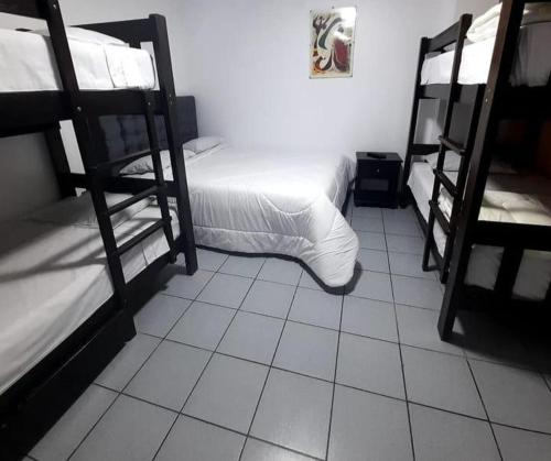 Postel nebo postele na pokoji v ubytování Hotel Pico Alto, La Planicie