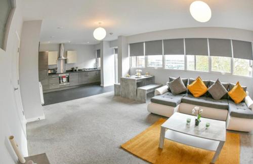 a living room with a couch and a table at St Edmunds House in Ipswich