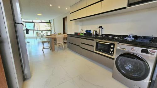 Cucina o angolo cottura di Apartamento de luxo à beira-mar