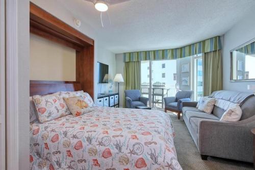 a bedroom with a bed and a couch at 2501 S Ocean Blvd, 1017 - Ocean View Sleeps 6 in Myrtle Beach