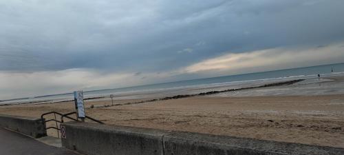 a view of a beach with the ocean at Cabourg Plage in Cabourg