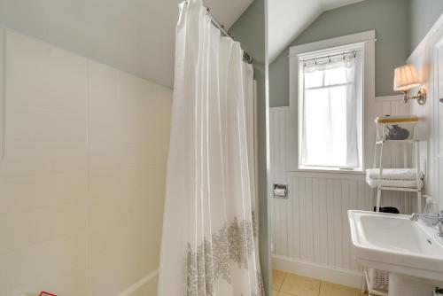 a bathroom with a shower curtain and a sink at Oceanfront Moclips Retreat with Beach Access and View! in Moclips