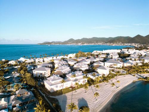 an aerial view of a resort next to the ocean at Sun Passion Condo in Marigot