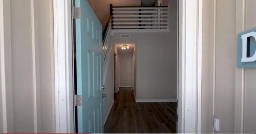 an empty hallway with a staircase in a house at 1408 Perrin Dr, Unit D - Ocean Walk Sleeps 8 in Myrtle Beach