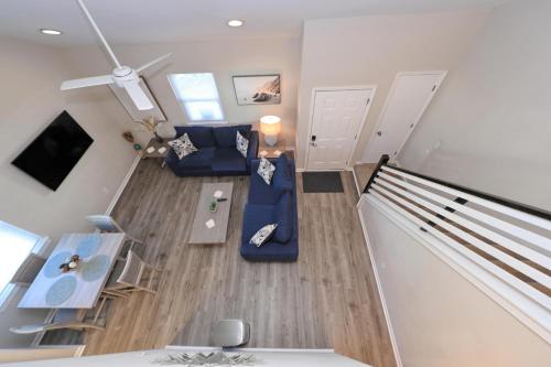 an overhead view of a living room with a blue couch at 1408 Perrin Dr, Unit D - Ocean Walk Sleeps 8 in Myrtle Beach