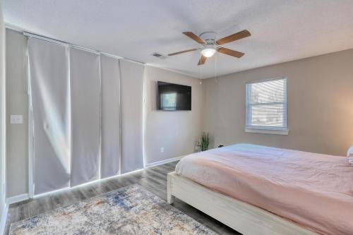 a bedroom with a bed and a ceiling fan at 1408 Perrin Dr, Unit D - Ocean Walk Sleeps 8 in Myrtle Beach