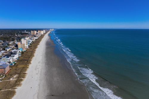 an aerial view of a beach with buildings and the ocean at 1408 Perrin Dr, Unit D - Ocean Walk Sleeps 8 in Myrtle Beach