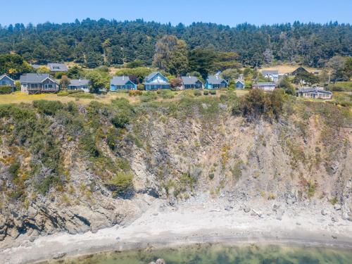 an aerial view of houses on a cliff at SCP Mendocino Coast Lodge in Albion