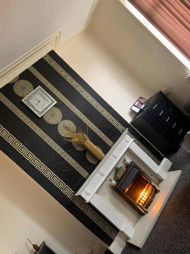 an overhead view of a living room with a fireplace at Apartment Bradford in Bradford