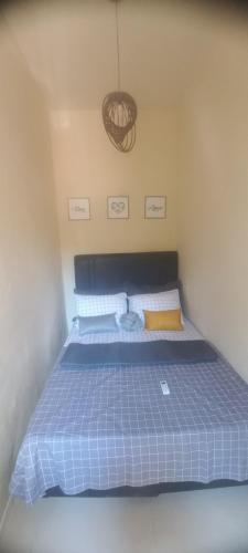 Cama o camas de una habitación en Suíte Ponta da Areia