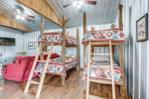 a bedroom with two bunk beds and a couch at Rustic Lake City Studio Near Ichetucknee Springs! in Lake City