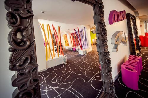 a mirror in a dressing room with skis at Hotel Da Vinci in Milan