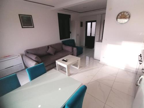 a living room with a couch and a table at Olea in Tivat