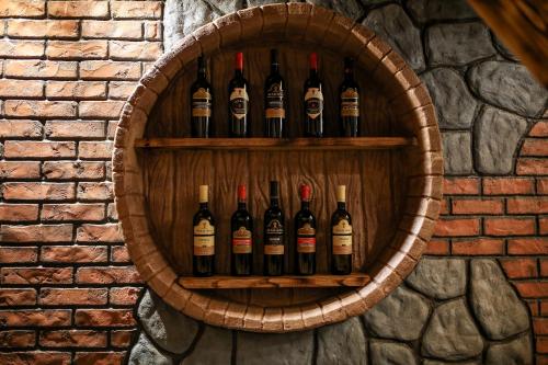 a bunch of bottles of wine on a wall at Chateau Milisi in Batumi
