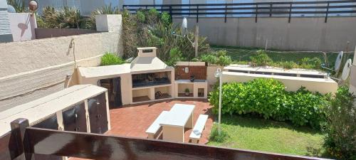 a model of a house on a roof at Tritones Playa in Pinamar