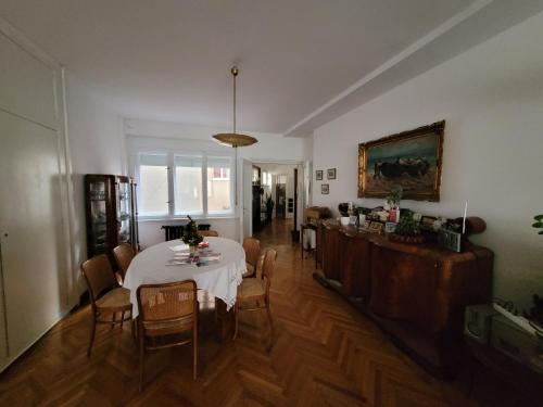 a dining room with a table and chairs in a room at HelloZagreb Apartment in Zagreb