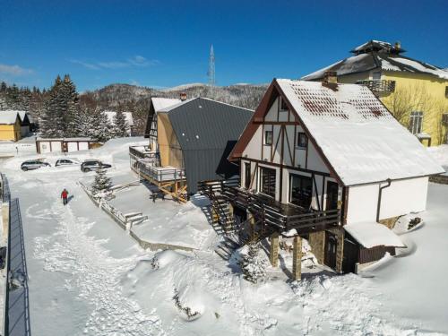 an aerial view of a house in the snow at Alpine Retreat Čupino Sokače in Kopaonik