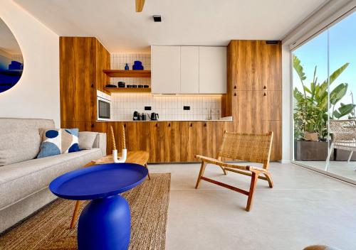 a living room with a couch and a table at ZAMA Bella Vista - Swimming pool - AC in Acantilado de los Gigantes