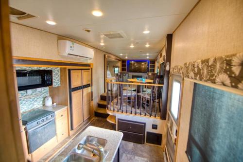 an interior view of an rv kitchen with a sink at منتجع شاطئ الورد in Yanbu