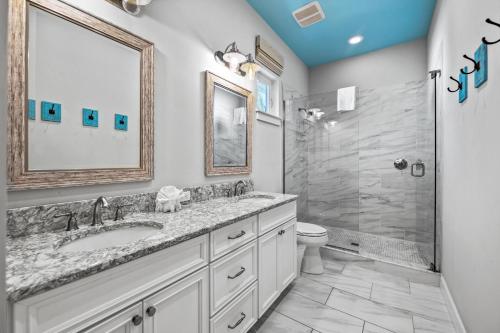 a bathroom with a sink and a shower at Spring Haven in Anna Maria