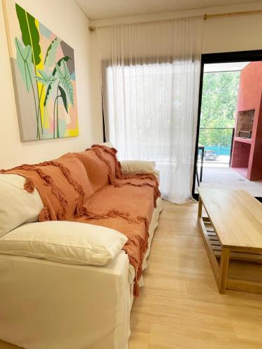 a living room with a couch and a table at Altos de la Cañada in Pilar