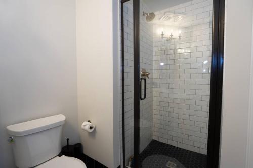 a bathroom with a toilet and a shower at Notorious Outlaw in Denver