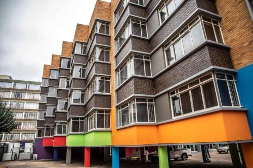 a tall building with a colorful facade at Feel Home in Pretoria