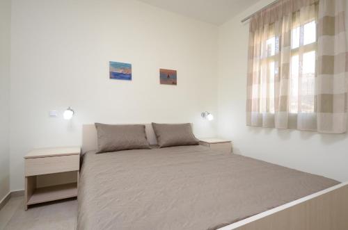 Ένα ή περισσότερα κρεβάτια σε δωμάτιο στο Natura Villas in Naxos