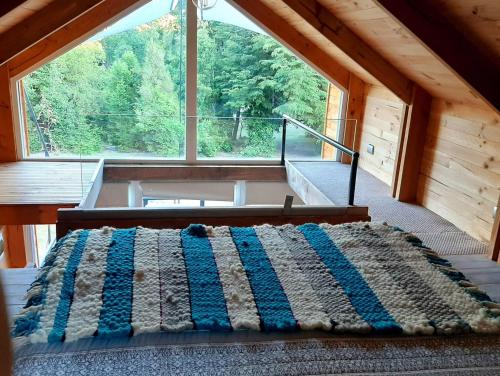 A bed or beds in a room at Tiny House Conguillio