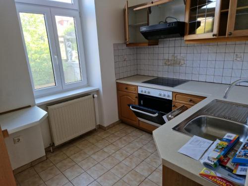 a kitchen with a sink and a stove top oven at Villa SCS Nähe in Wiener Neudorf