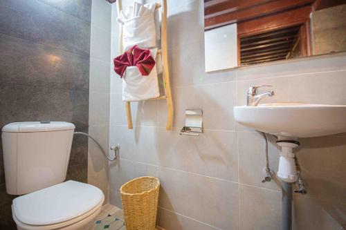 a bathroom with a toilet and a sink at Riad Soultan in Fès