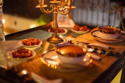 a table with plates of food on top of it at Riad Soultan in Fès