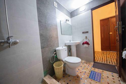 a bathroom with a toilet and a sink at Riad Soultan in Fès