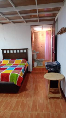 Postel nebo postele na pokoji v ubytování Rancho los Alebrijes Zacatlan